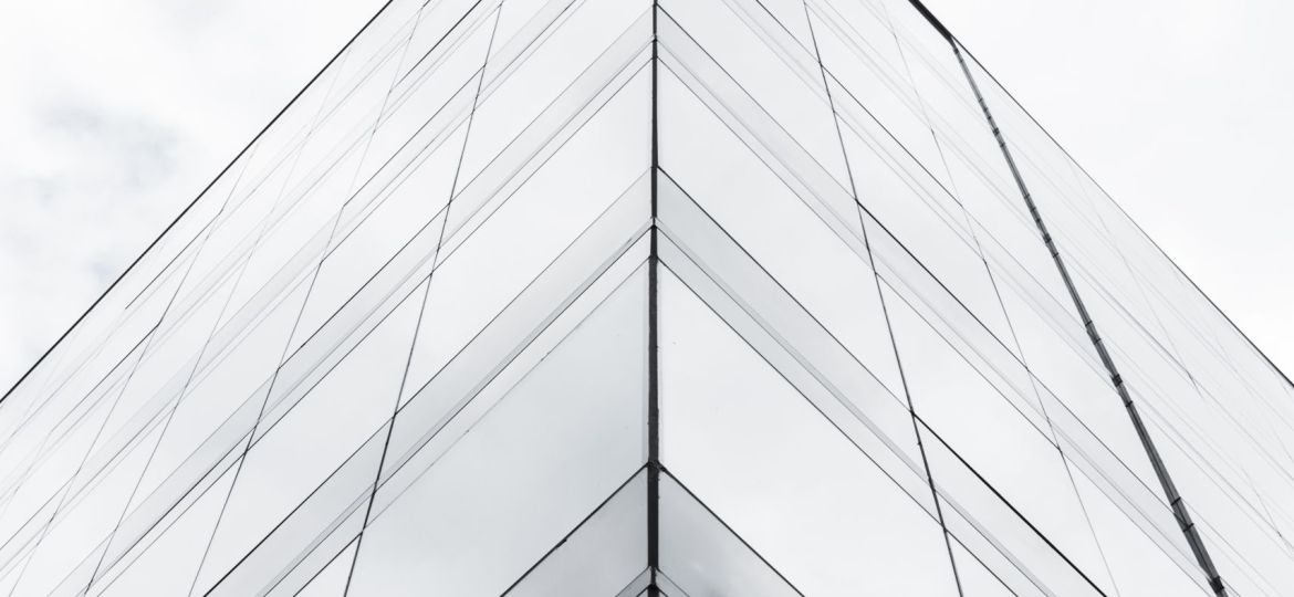 low-angle-tall-building-grayscale